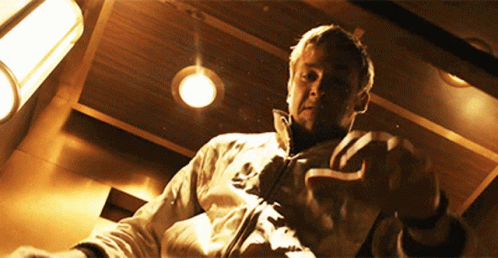 A Man In A White Jacket With The Word Adidas On The Front GIF