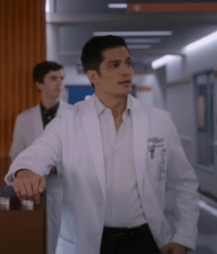 A Man In A White Lab Coat Has A Pocket With A Pen In It GIF
