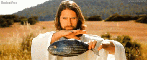 A Man In A White Robe Is Holding A Large Fish In His Hands And The Words Randomweas Are On The Bottom GIF