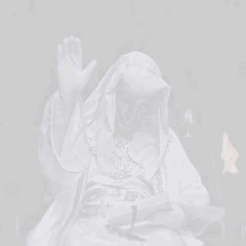 Man In White Robe Reading Book And Waving GIF