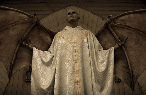 A Man In A White Robe With Gold Crosses On The Sleeves Has Wings GIF