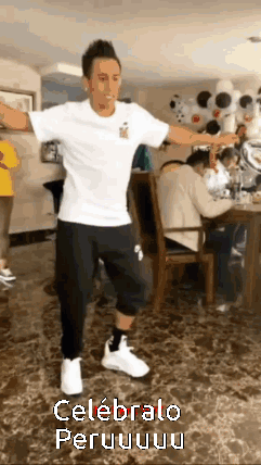 A Man In A White Shirt And Black Pants Is Dancing In A Room With The Words Celebralo Peru On The Bottom GIF