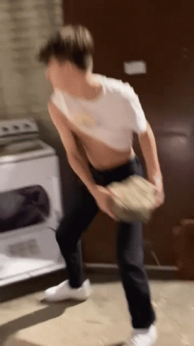 Man In White Shirt Standing By Washing Machine GIF