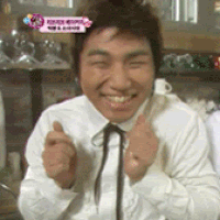 a man in a white shirt and black tie is smiling