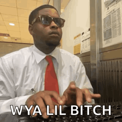 A Man In A White Shirt And Red Tie Is Typing On A Keyboard With The Words Wya Lil Bitch Written Below Him GIF