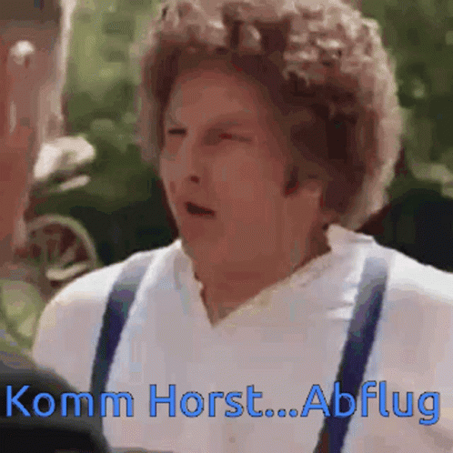 A Man In A White Shirt And Suspenders Says Komm Horst GIF