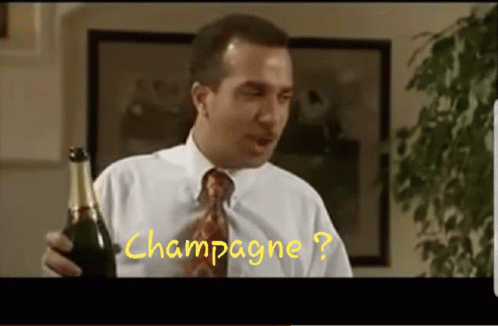 A Man In A White Shirt And Tie Holds A Bottle Of Champagne In Front Of A Picture That Says Champagne GIF
