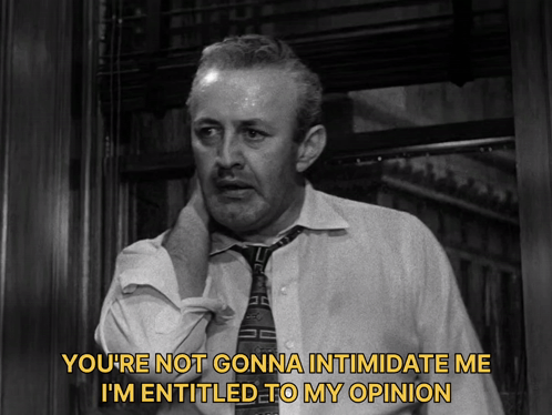 a man in a white shirt and tie is saying you 're not gonna intimidate me i 'm entitled to my opinion