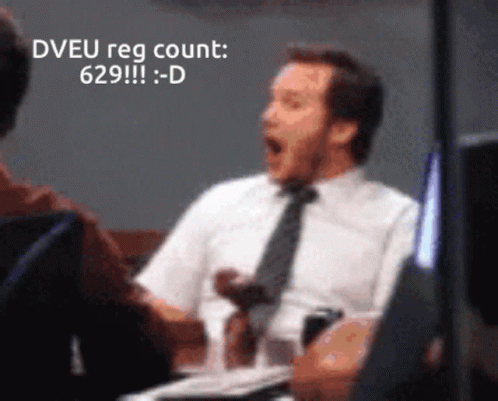 A Man In A White Shirt And Tie Is Sitting At A Table With His Mouth Open And The Words Dveu Reg Count Written Above Him GIF