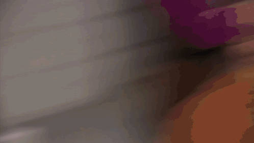 A Man In A White Shirt And Tie Is Smiling Behind A Blind GIF