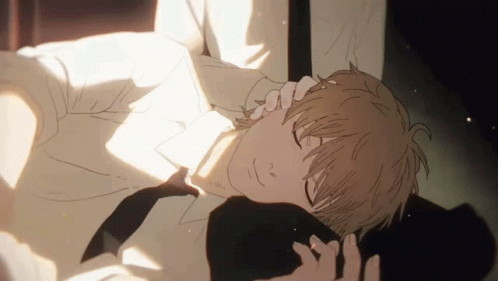 A Man In A White Shirt And Tie Laying Down With His Eyes Closed GIF