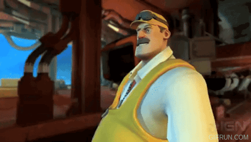 A Man In A White Shirt And Yellow Vest Is Standing In Front Of Ign GIF