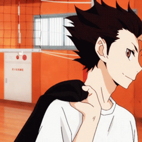 A Man In A White Shirt Has A Black Jacket On His Shoulder GIF