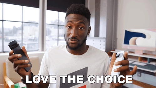 A Man In A White Shirt Holds Two Phones In His Hands And Says Love The Choice GIF