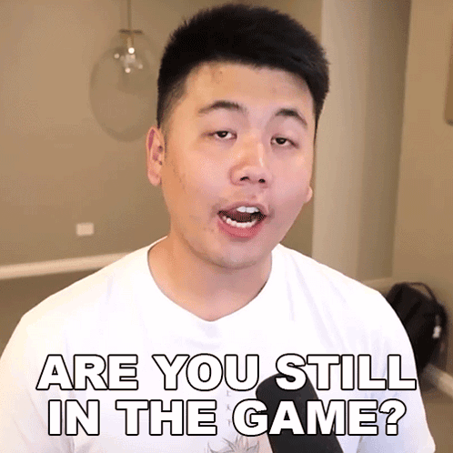 A Man In A White Shirt Is Asking " Are You Still In The Game " GIF