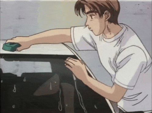 A Man In A White Shirt Is Cleaning A Table GIF