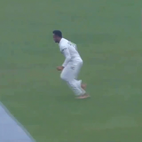 A Man In A White Shirt Is Doing Push Ups In The Ocean . GIF