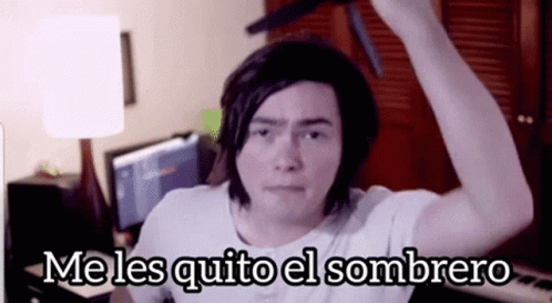 A Man In A White Shirt Is Holding A Knife Over His Head With The Words Me Les Quito El Sombrero Above Him GIF