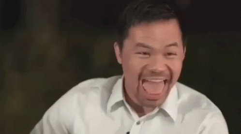 A Man In A White Shirt Is Making A Funny Face . GIF