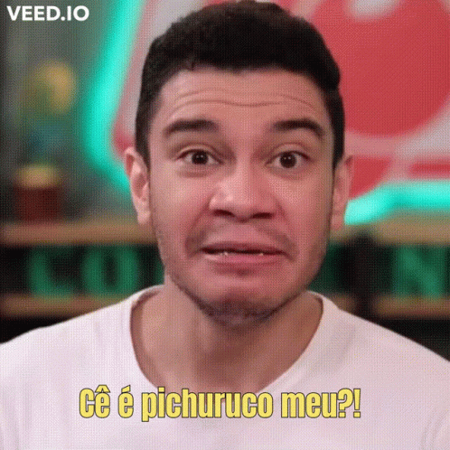 A Man In A White Shirt Is Making A Funny Face And Saying " Ce E Pichuruco Meu " GIF