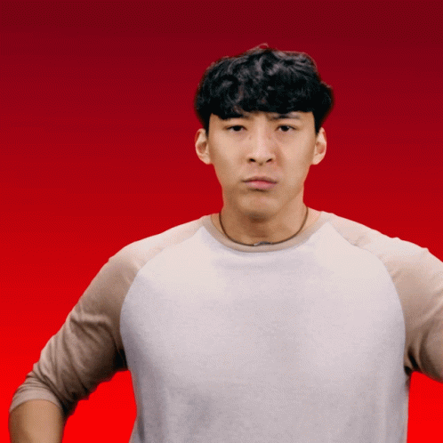 A Man In A White Shirt Is Making A Funny Face With His Hands On His Hips GIF