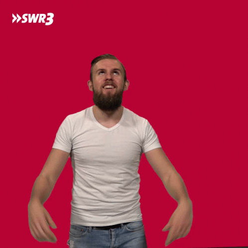 A Man In A White Shirt Is Raising His Hands In The Air With A Swr3 Logo In The Background GIF