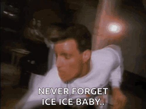 A Man In A White Shirt Is Saying Never Forget Ice Ice Baby .. GIF