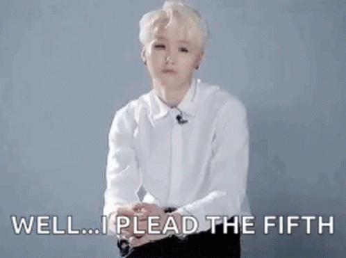 A Man In A White Shirt Is Sitting Down With His Hands Outstretched And Says `` Well ... I Plead The Fifth '' . GIF