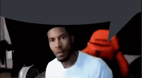 A Man In A White Shirt Is Sitting In A Chair With A Speech Bubble Above His Head . GIF