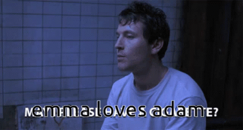Man In White Shirt Sitting With Nemmasloves Adame Text GIF