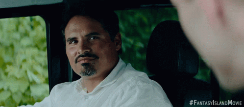 A Man In A White Shirt Is Sitting In The Back Seat Of A Car With #Fantasyislandmovie Written On The Bottom Right GIF