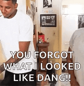 A Man In A White Shirt Is Standing In A Room And Saying `` You Forgot What I Looked Like Dang !! '' GIF