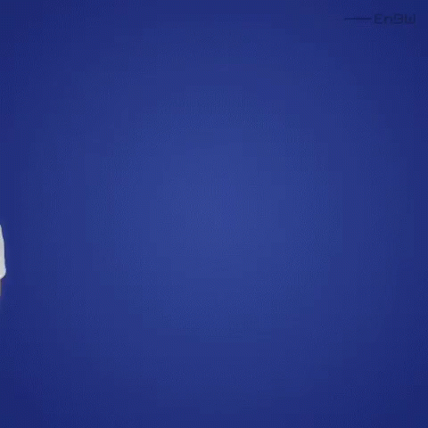 a man in a white shirt is standing in front of a blue background looking up .