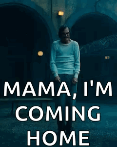 A Man In A White Shirt Is Standing In Front Of A Tunnel And Says Mama I 'M Coming Home . GIF