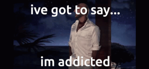 A Man In A White Shirt Is Standing In Front Of The Ocean With The Words Ive Got To Say Im Addicted GIF