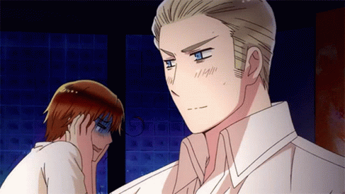 A Man In A White Shirt Is Standing Next To Another Man In A Brown Shirt GIF