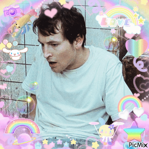 Man In White Shirt Surrounded By Rainbows And Hearts GIF