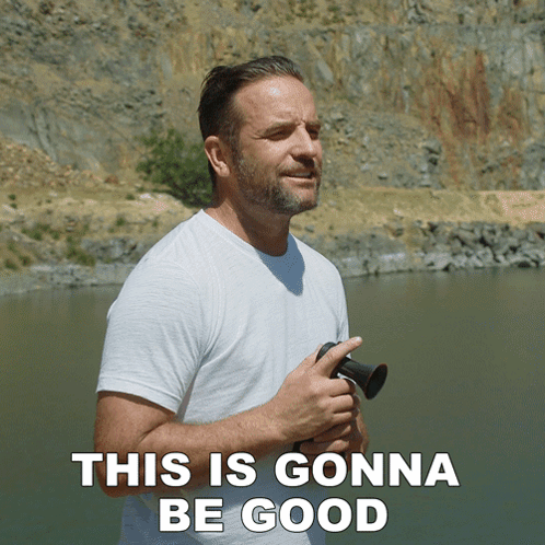 A Man In A White Shirt Stands In Front Of A Body Of Water With The Words This Is Gonna Be Good Above Him GIF