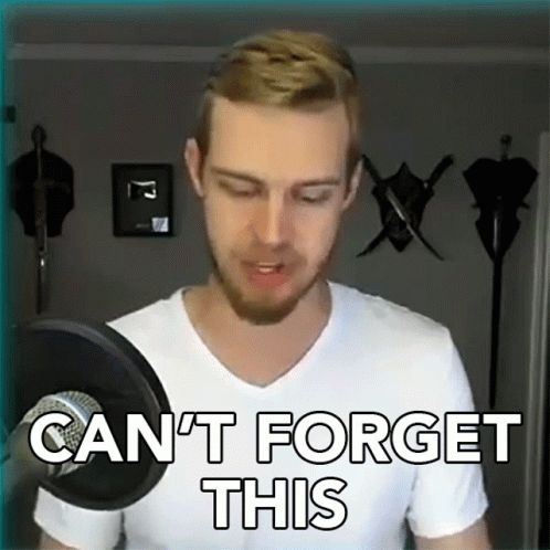 A Man In A White Shirt Stands In Front Of A Microphone And Says " Can 'T Forget This " GIF
