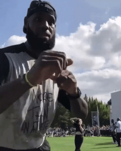A Man In A White Shirt That Says More Than An Athlete GIF