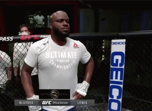 A Man In A White Shirt That Says Ultimate Championship GIF