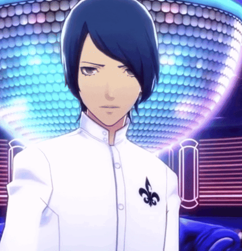 A Man In A White Shirt With A Black Fleur De Lis On His Chest GIF