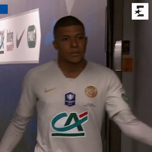 A Man In A White Shirt With A Ca Logo On The Front GIF