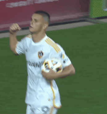A Man In A White Shirt With Herbalife On It GIF