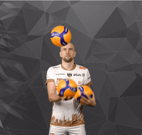 A Man In A White Shirt With The Number 17 Juggling Two Balls GIF