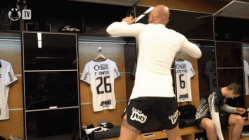 a man in a white shirt with the number 26 on the back