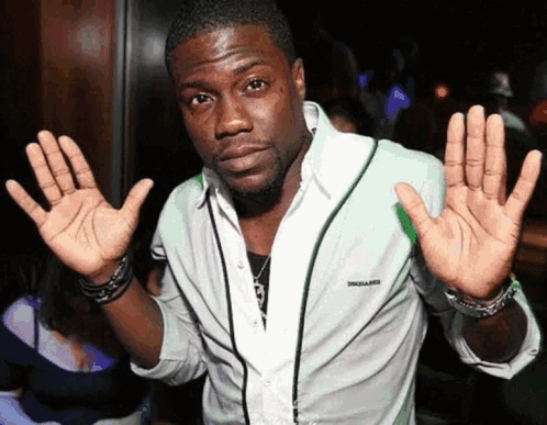 A Man In A White Shirt With The Word Dsquared On The Front GIF