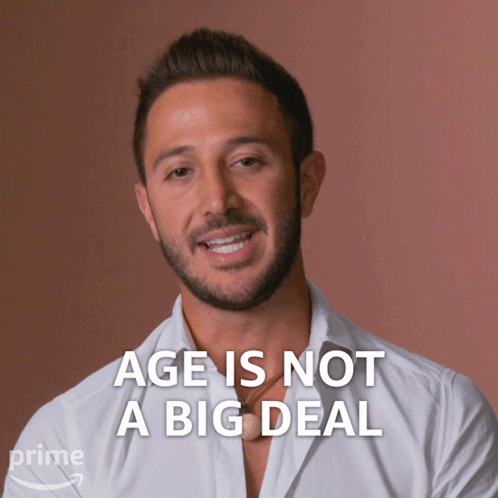 Man In White Shirt Saying Age Is Not A Big Deal GIF