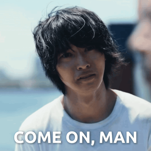 a man in a white shirt with the words come on man behind him