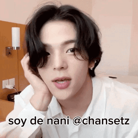 A Man In A White Shirt With The Words Soy De Nani @Chansetz On His Face GIF